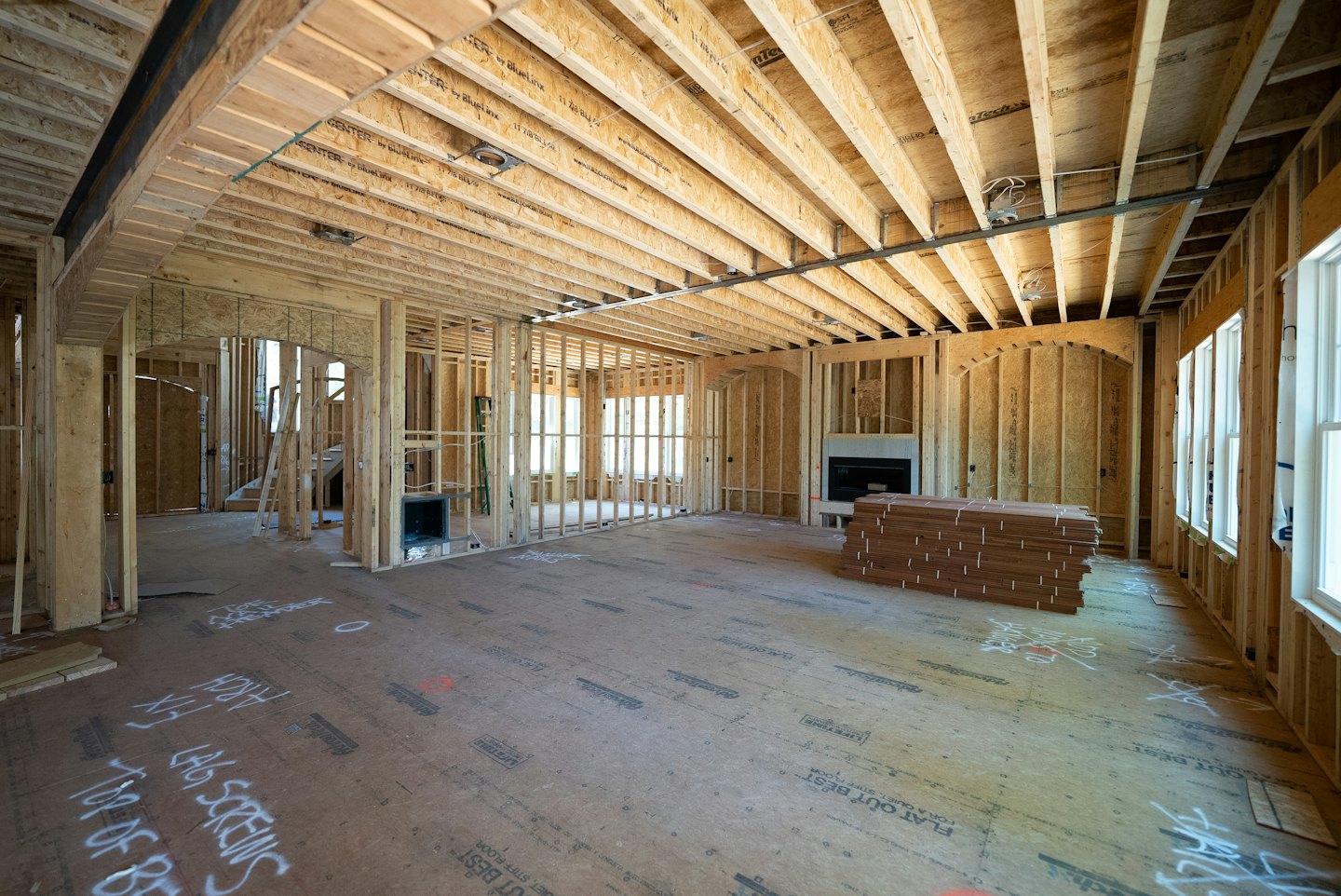 House framing under construction with exposed studs and joists.